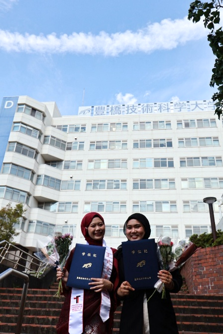 Graduation Portrait in Front of Campus Building